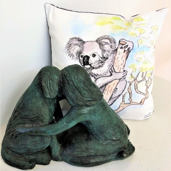 Kala the Koala printed on cushion cover. Pictured with 'Meeting of Minds' sculpture in bronze by Lucinda Brash