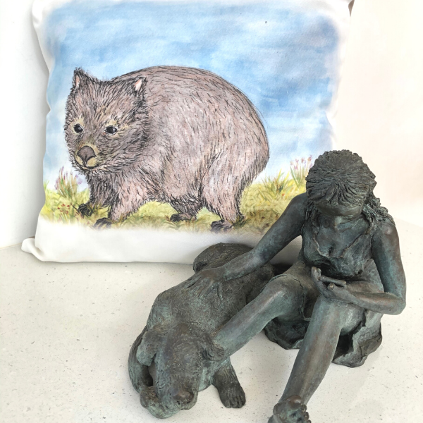 Hatty the Wombat on Cushion Cover pictured with 'Phone Support' bronze sculpture by Lucinda Brash